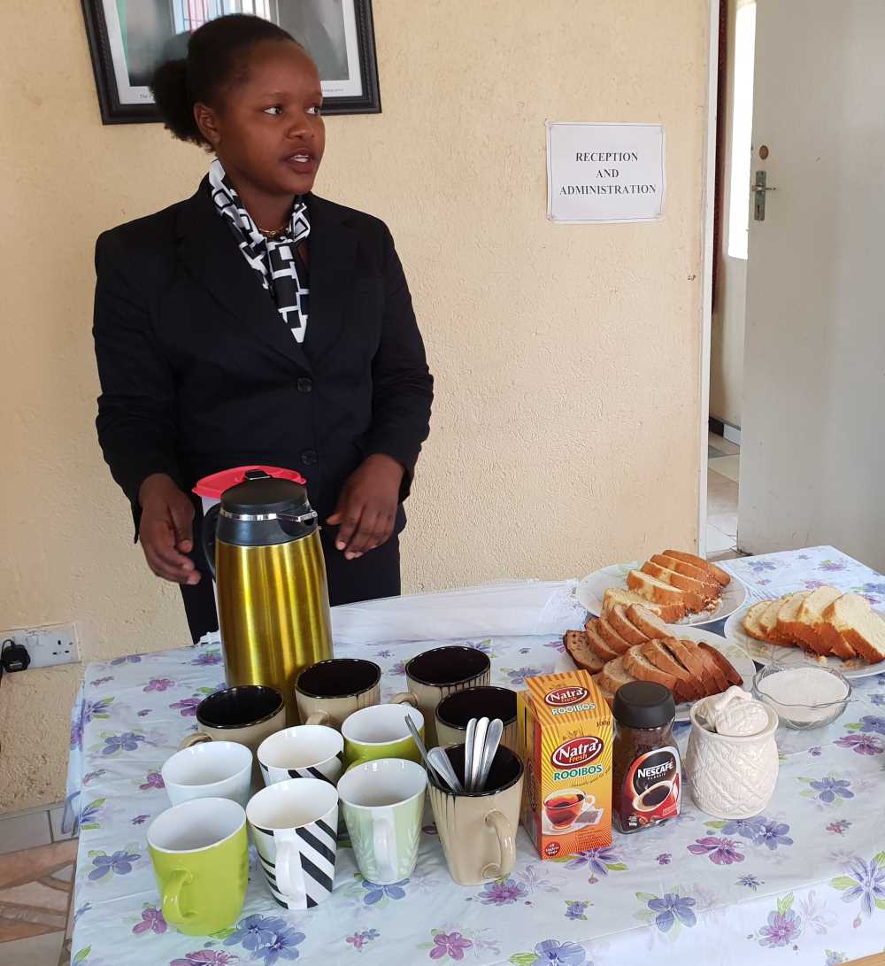 A student from the catering course proudly presents what she has prepared for a tea break